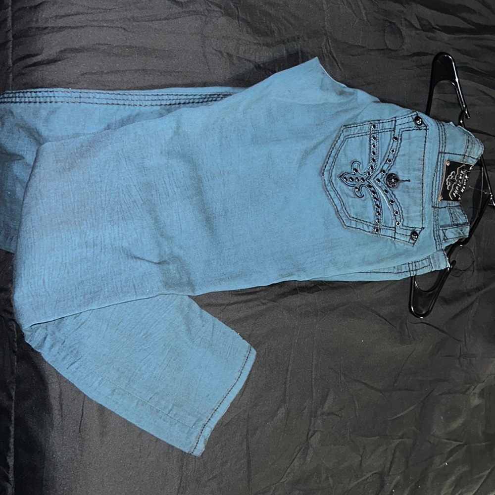 Rock Revival, size 32 with detailed stress rip with black rhinestones